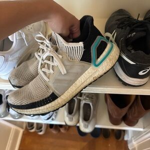 Black and White Adidas Ultraboosts with Teal Details